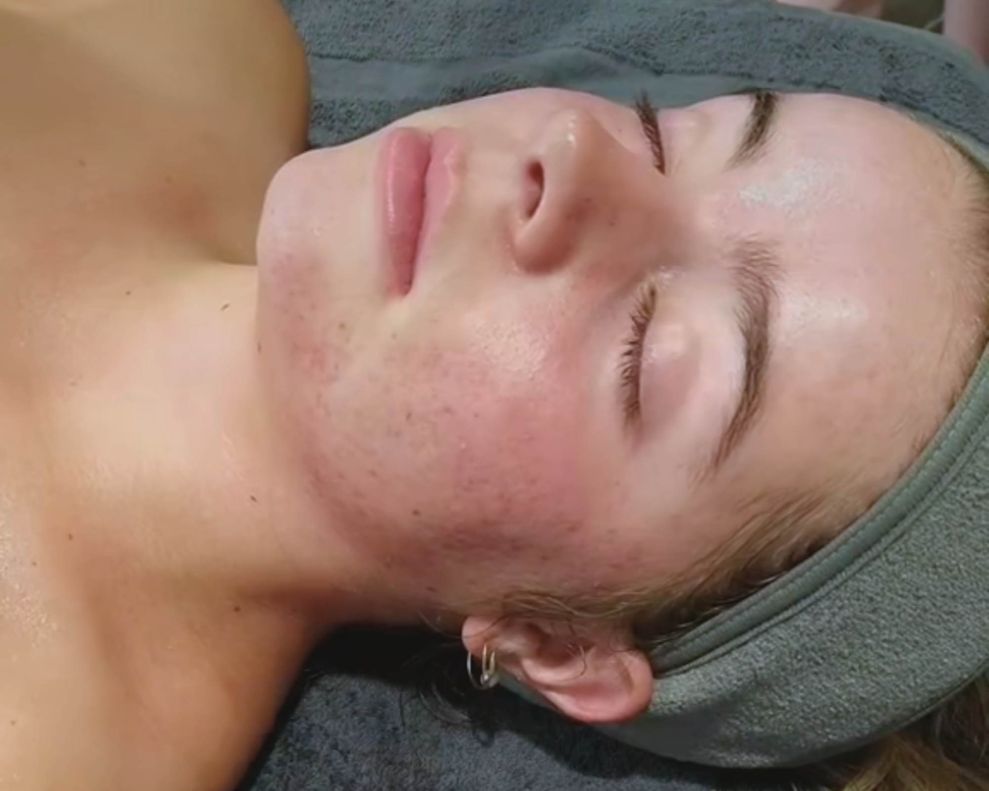 Client receiving facial treatment